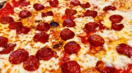 Closeup view of large pepperoni pizza